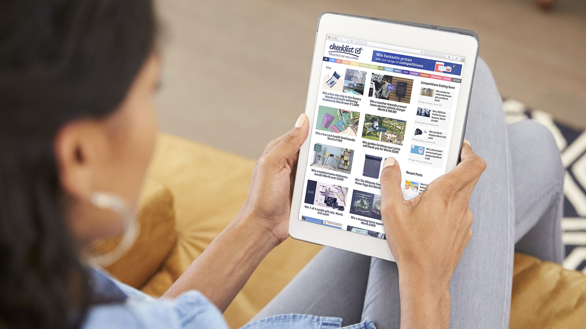 woman scrolling the internet on an iPad